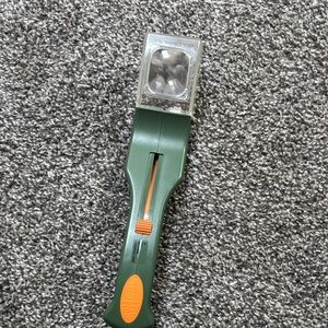 Green and Orange Magnifying Tool for outside bugs